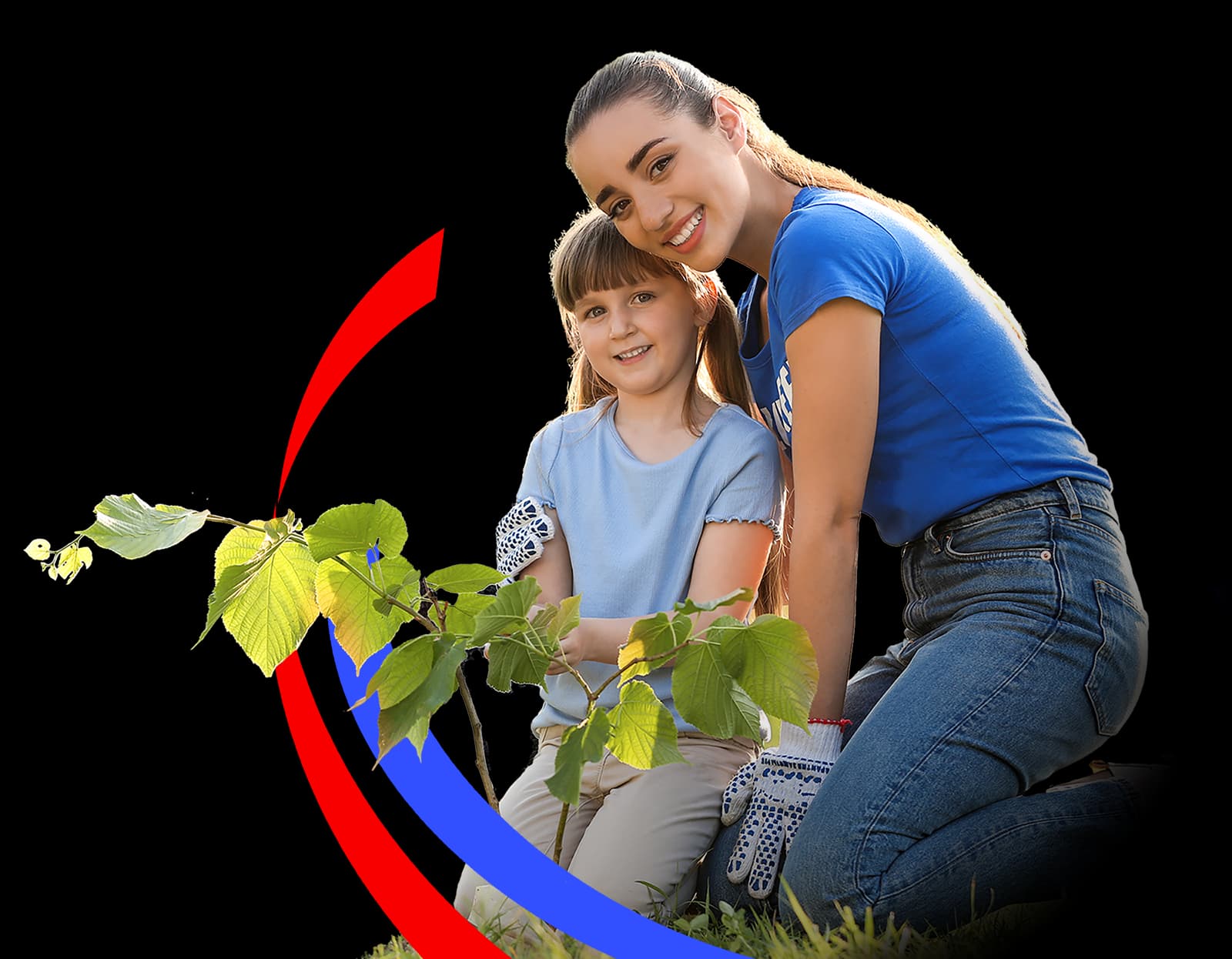 A woman and a small child planting a sapling while volunteering